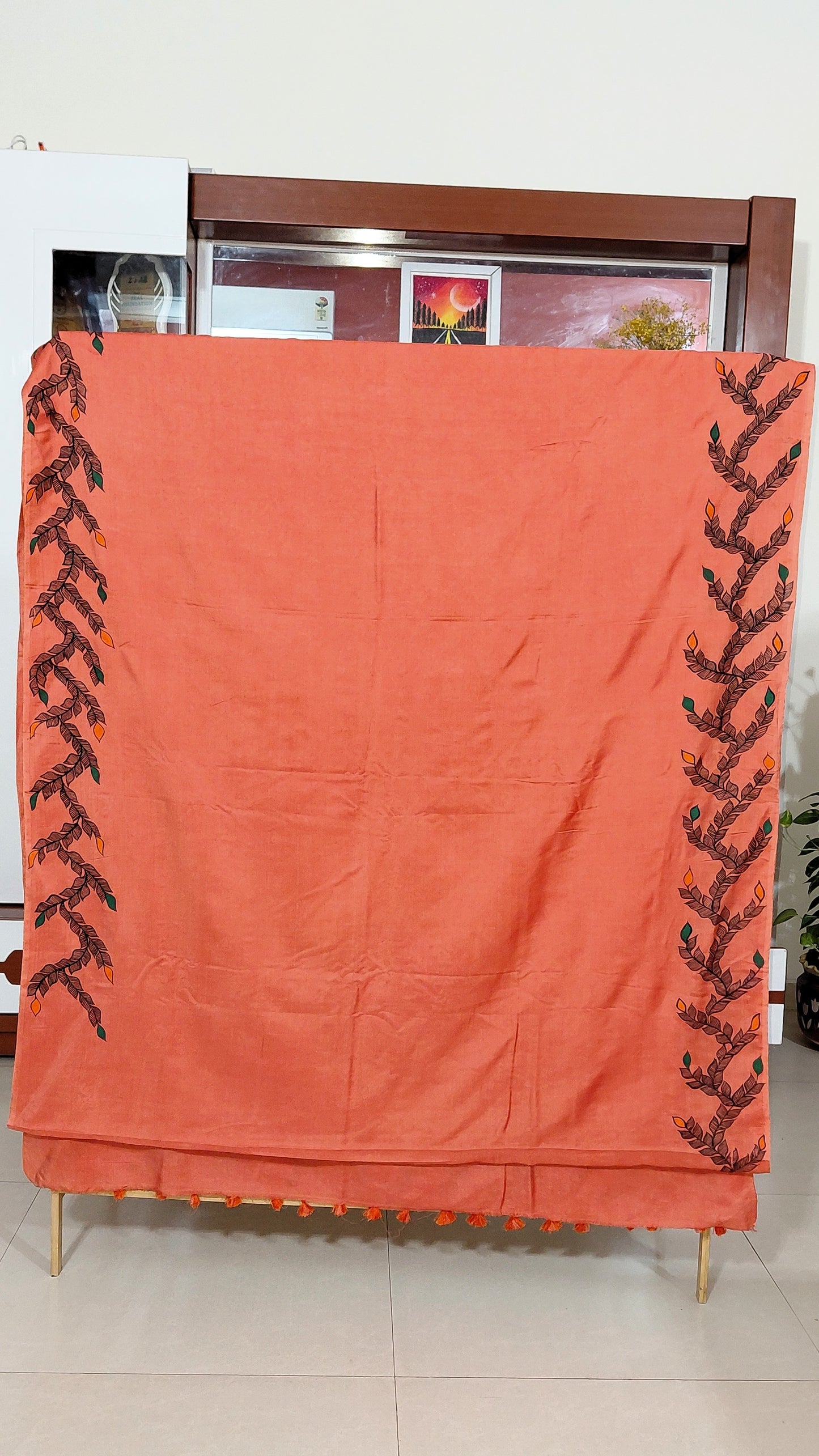 Traditional Madhubani art saree in coral peach shade