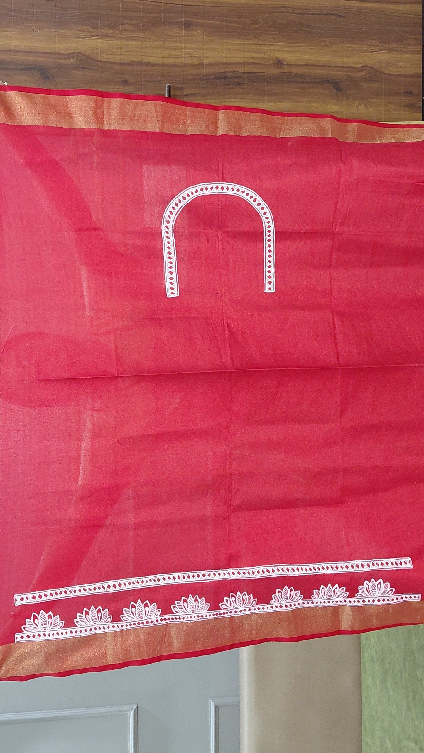 Matching red blouse piece with Madhubani detailing