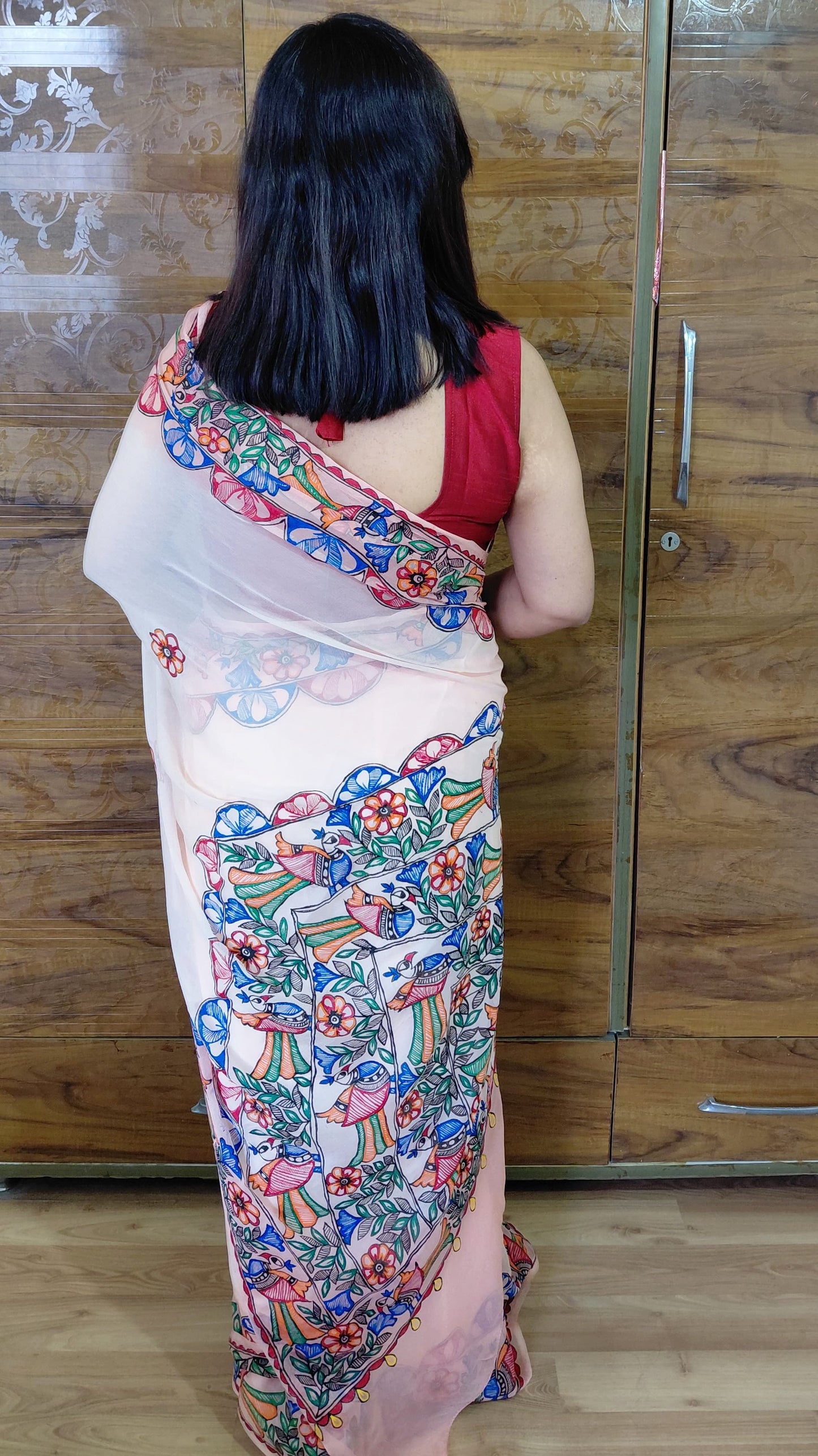 Back view of hand-painted Peacock Garden pallu on chiffon saree