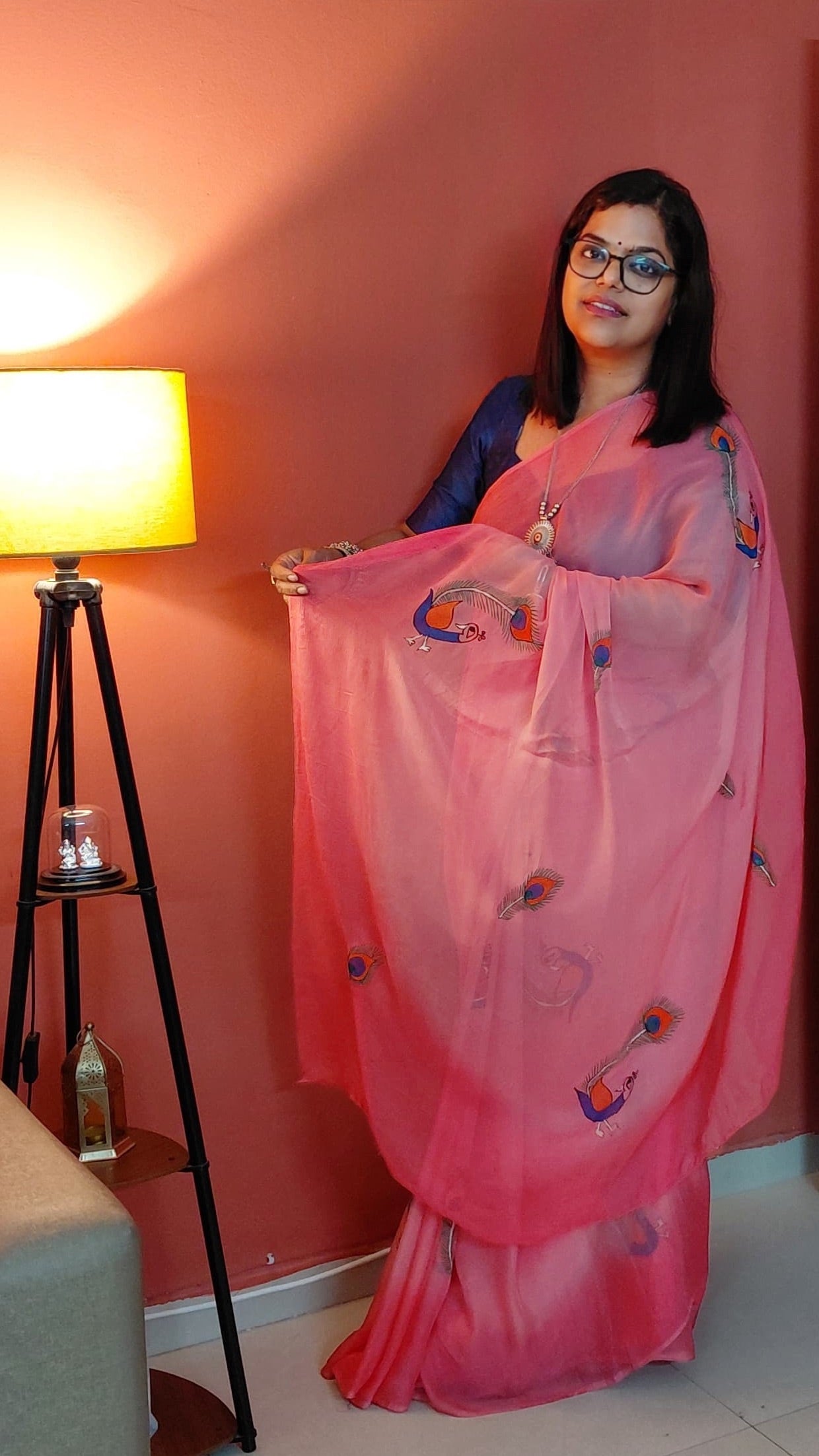 Elegant Peacock and Peacock Feather artwork on Candy Pink Chiffon Saree