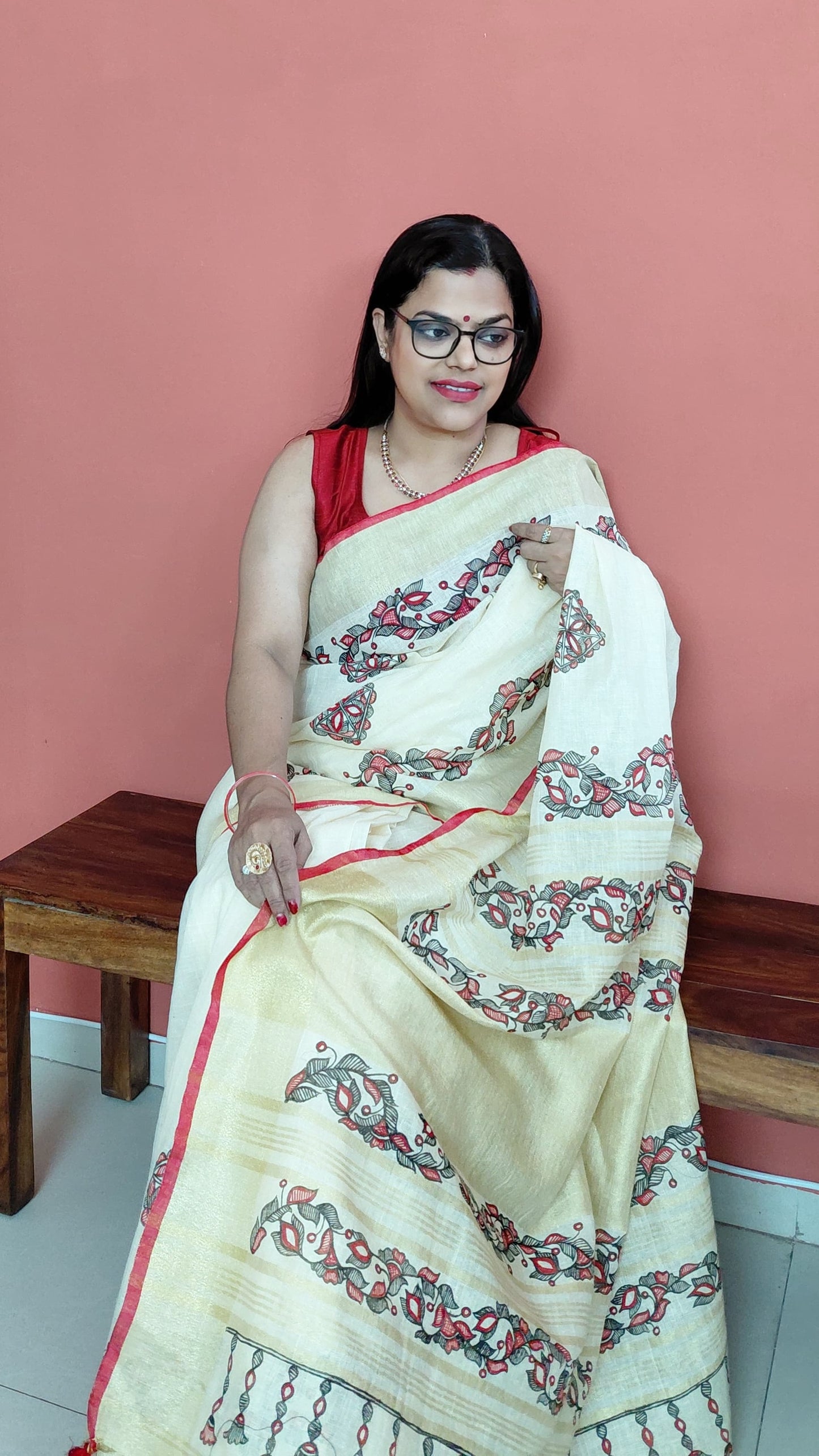 Elegant ivory linen saree with handcrafted detailing