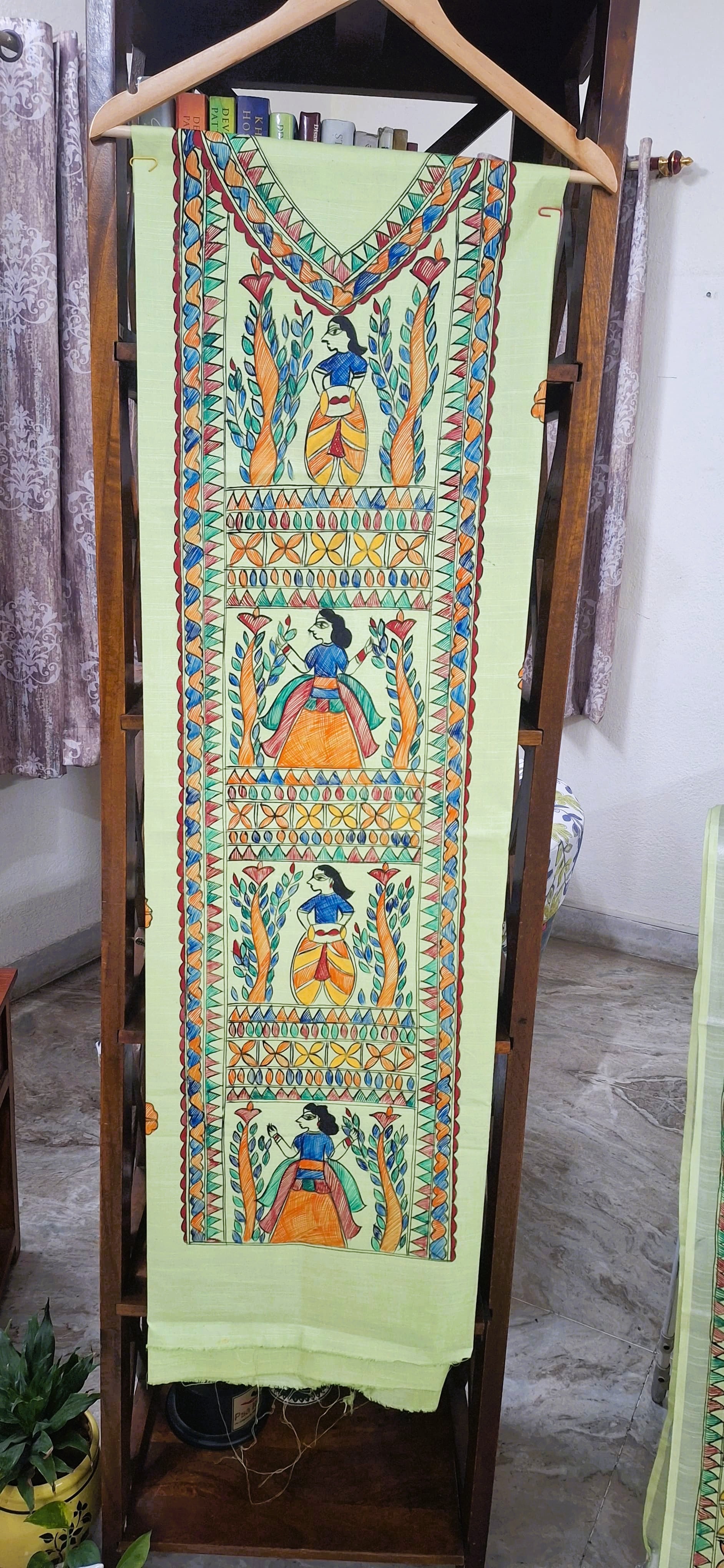 Green Madhubani kurta fabric with intricate hand-painted panel featuring traditional figures and motifs