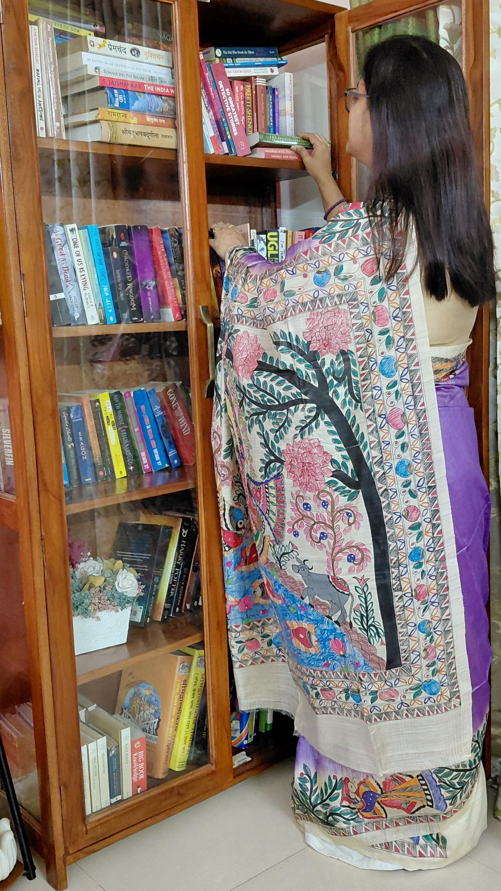 Hand-painted Madhubani saree with Radha Krishna swing theme