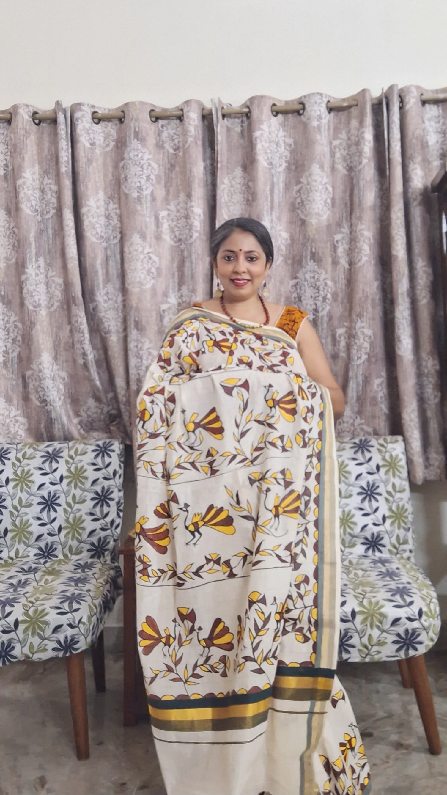 Handmade Sohrai art saree with earthy rust and mustard bird designs