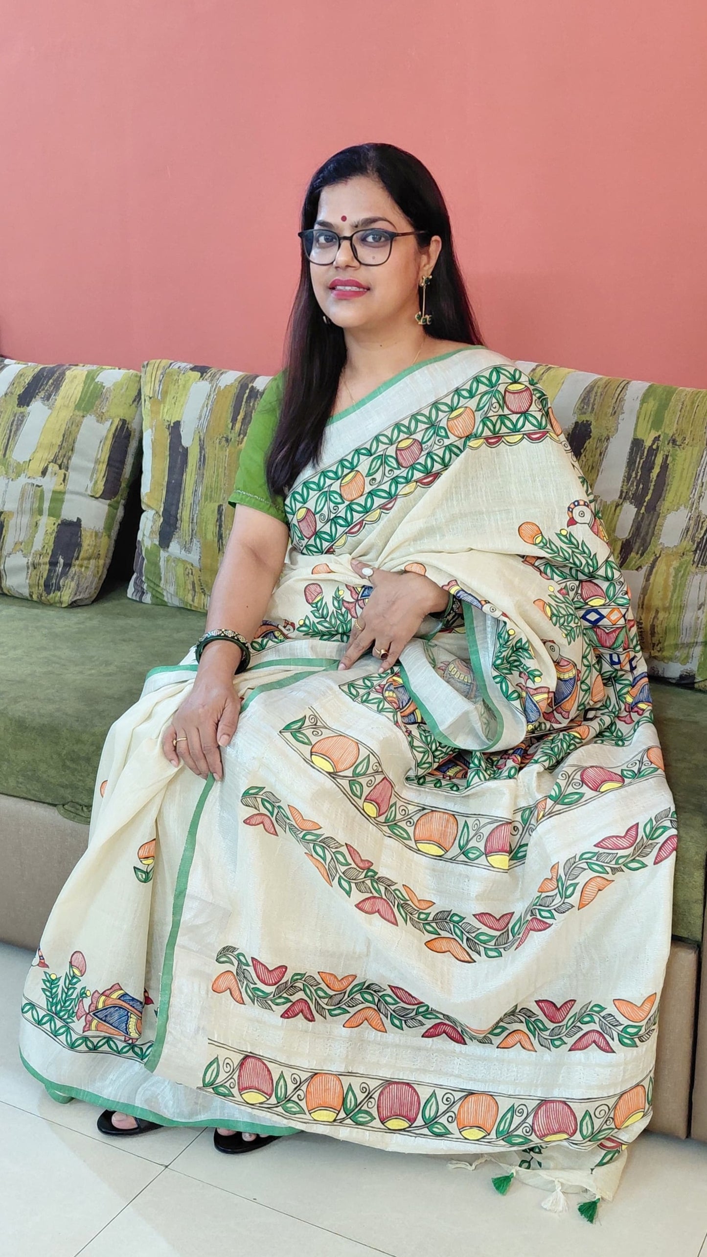 Lifestyle indoor shot of ivory Madhubani saree styling