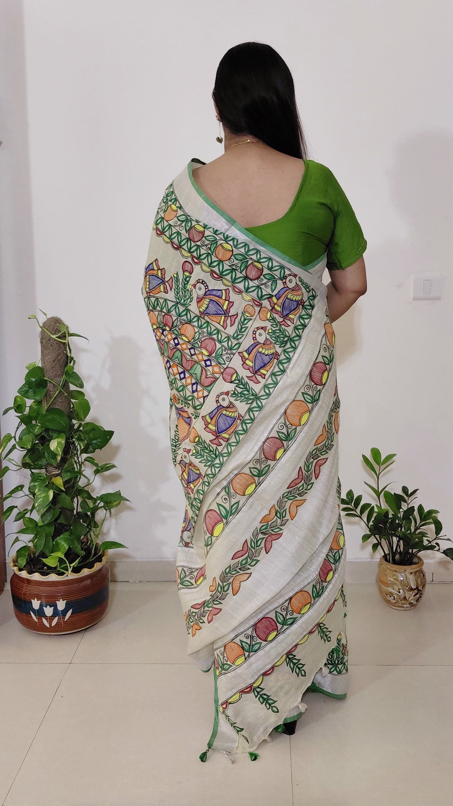 Back drape view highlighting madhubani painting saree mithila bird motif patterns