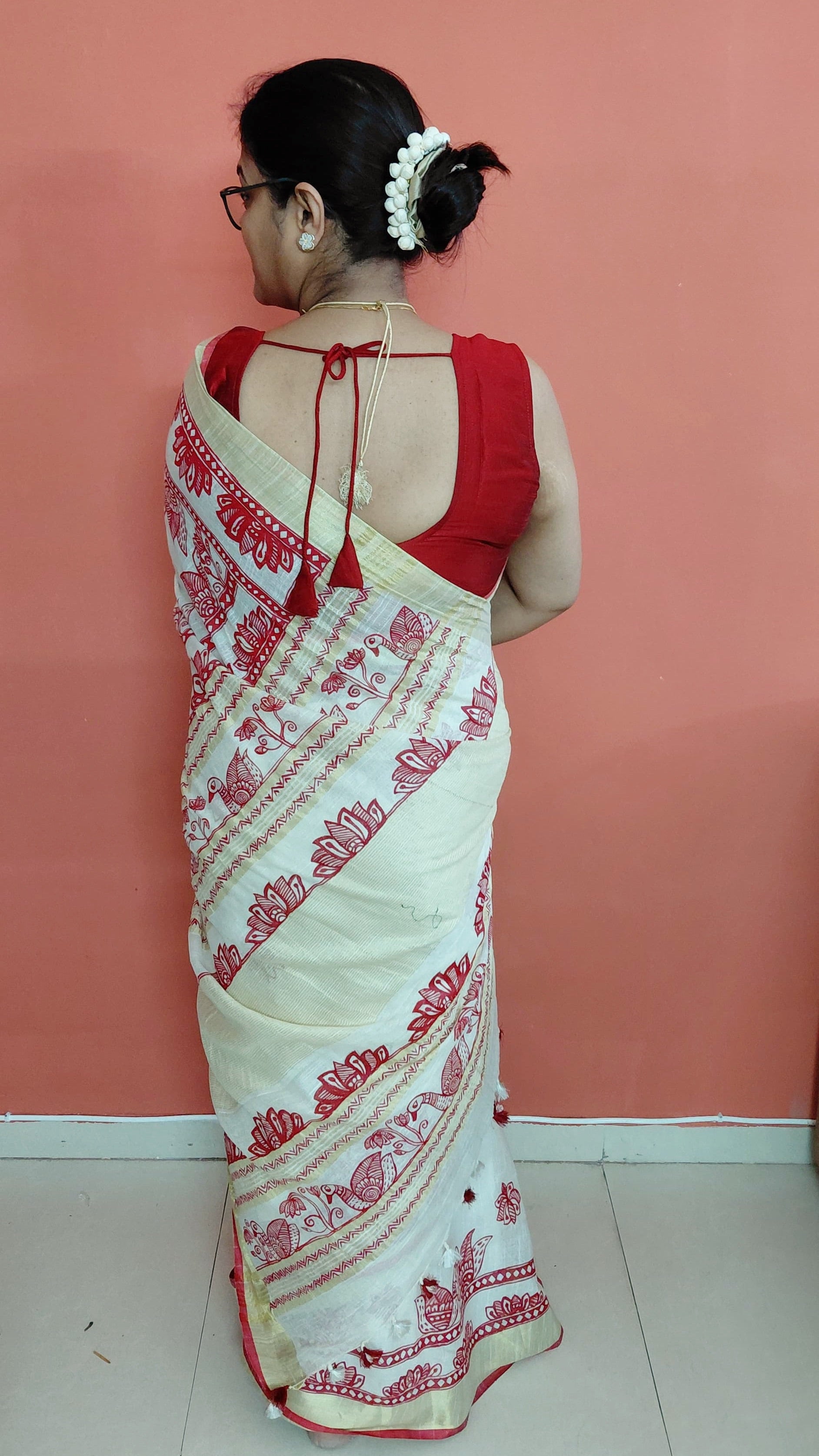 Ivory linen saree with lotus border design