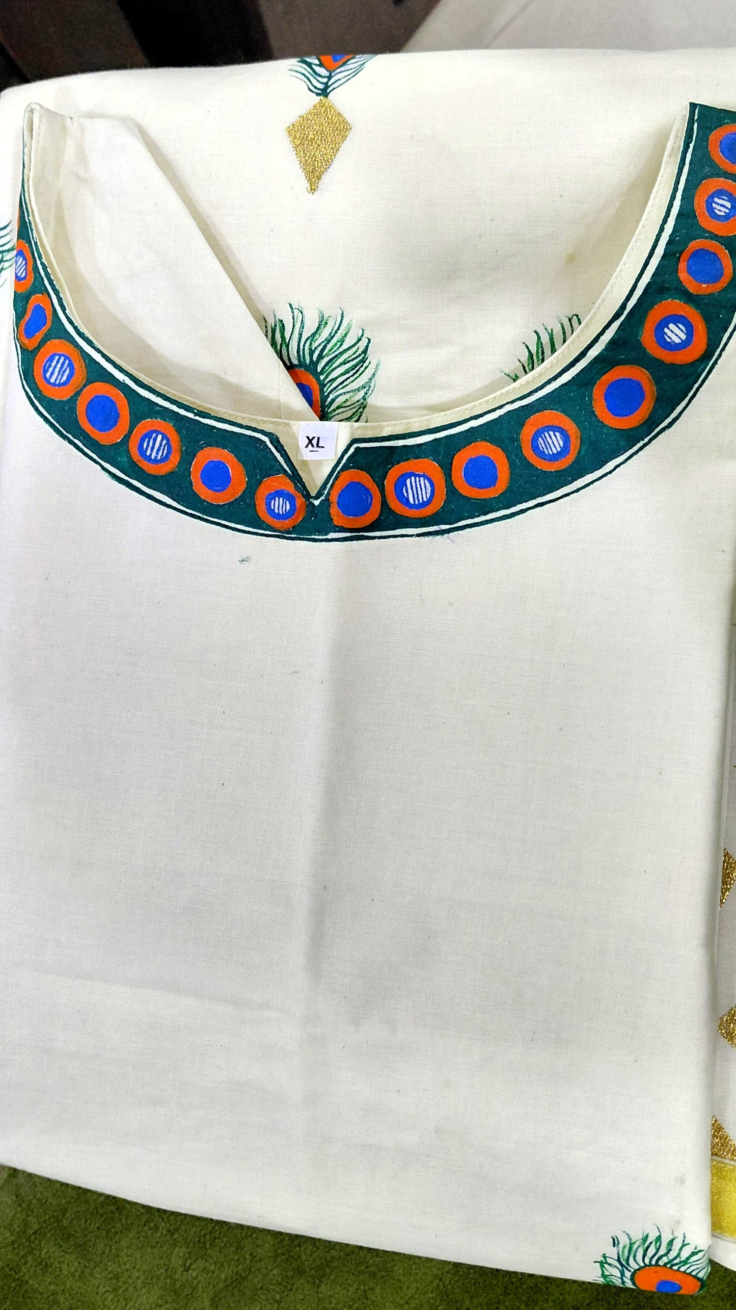 Hand-painted neckline detail with colourful folk art border design