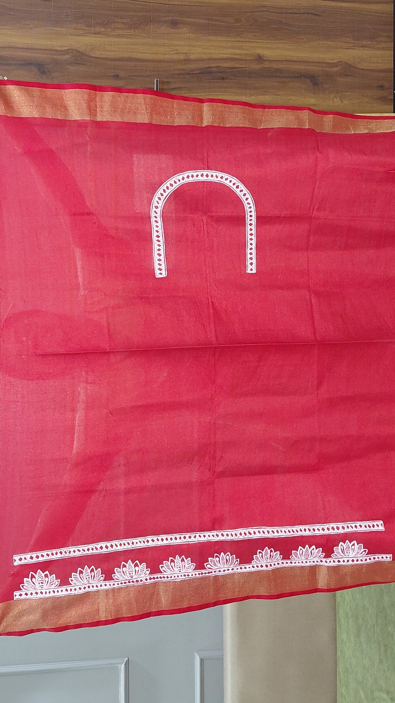Matching red blouse piece with Madhubani detailing