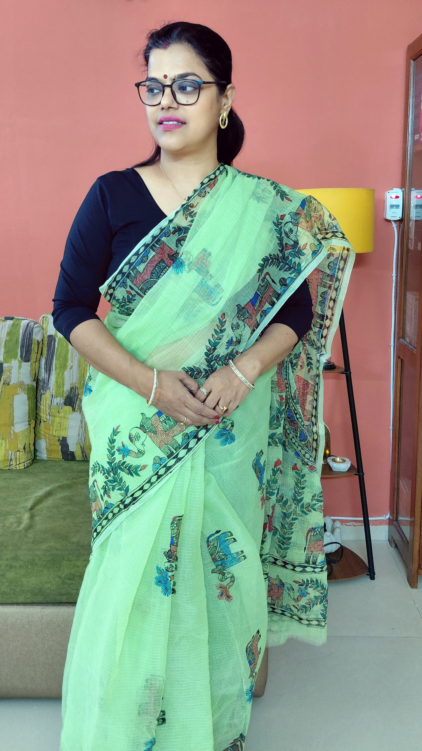 Pastel green Kota Doria saree with Madhubani artwork