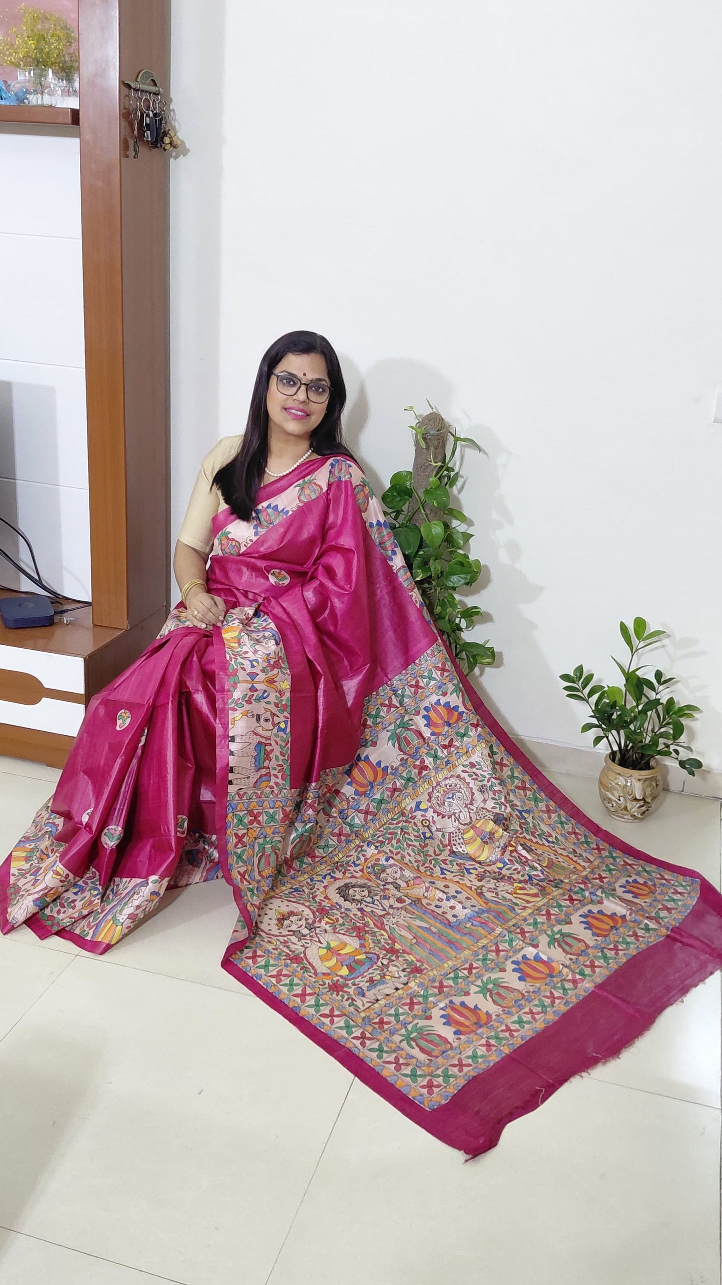 Model wearing devotional Madhubani saree with Shiv Parivar artwork