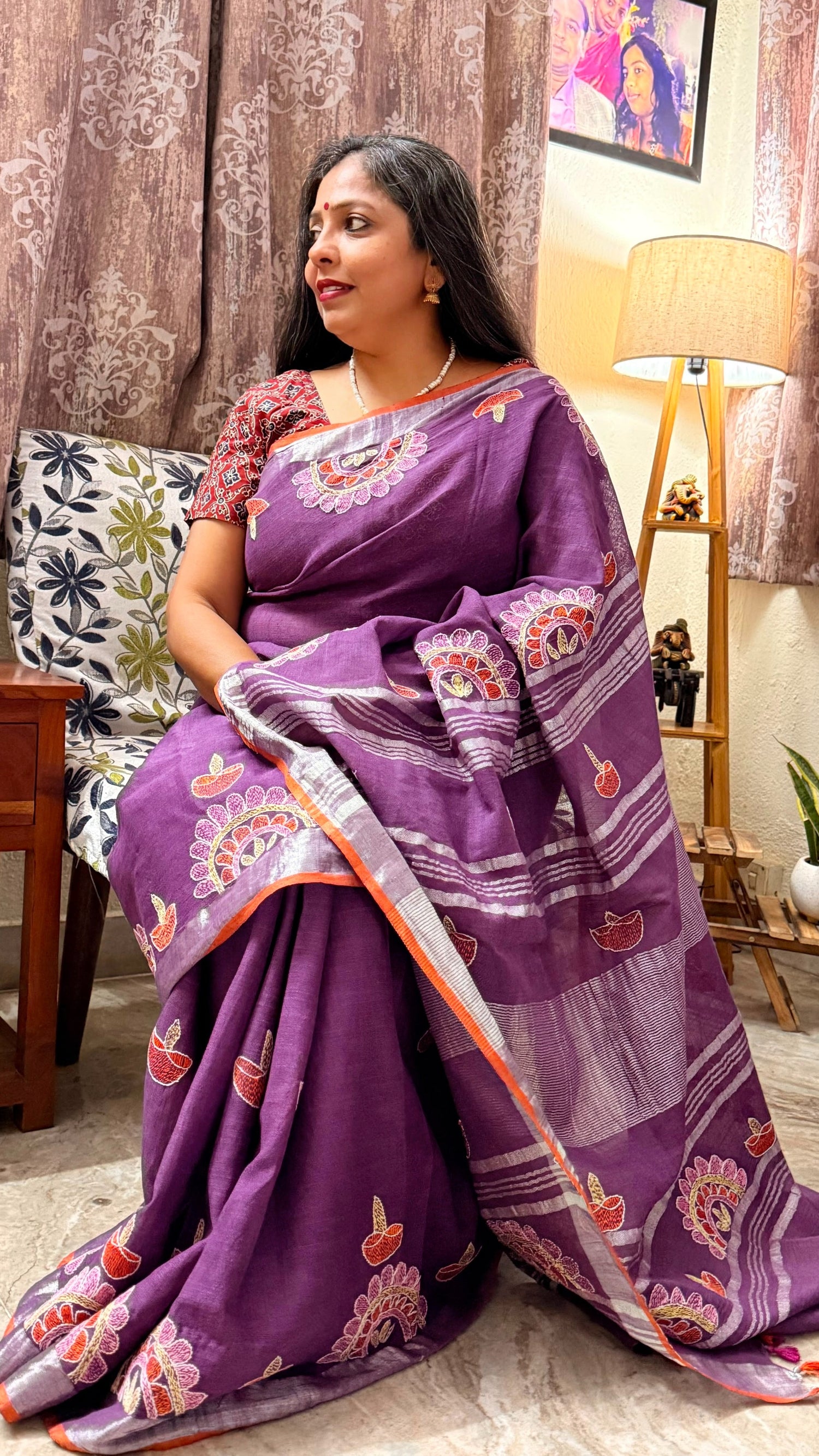 Royal purple Sujni embroidered linen saree with diya motifs worn by model
