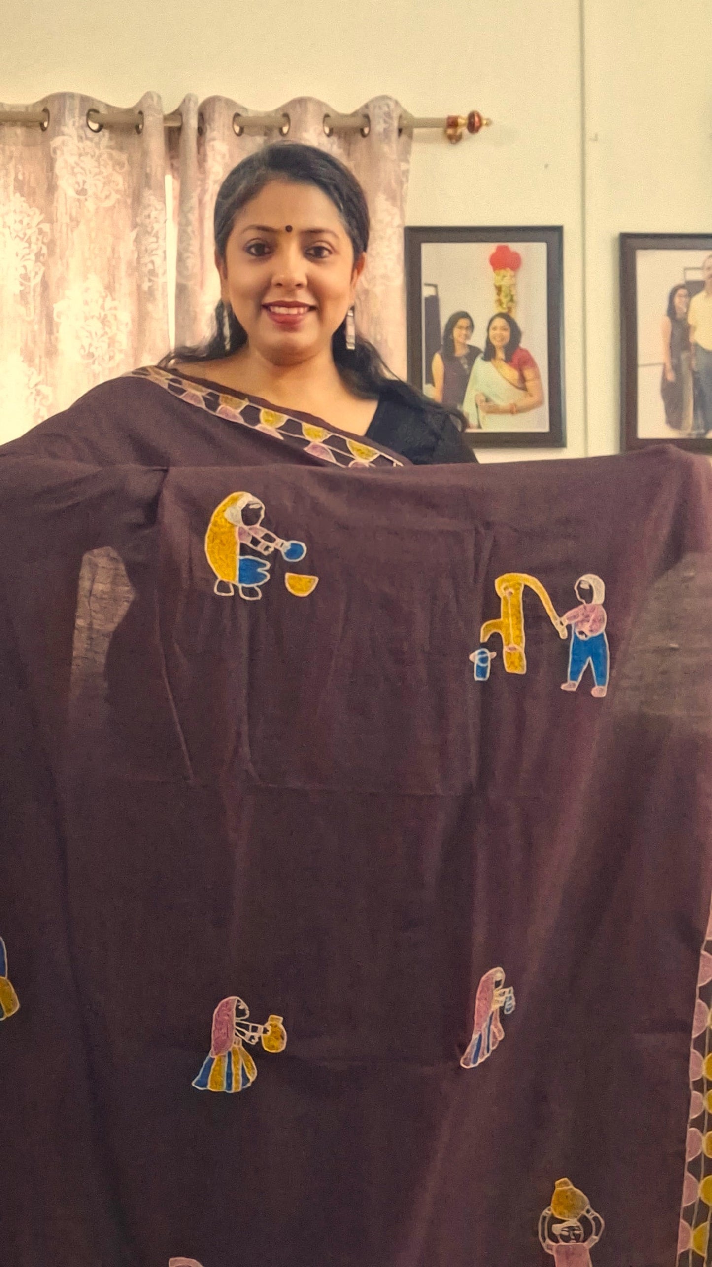 Close view of hand embroidered village life motifs on coffee brown Katan silk saree