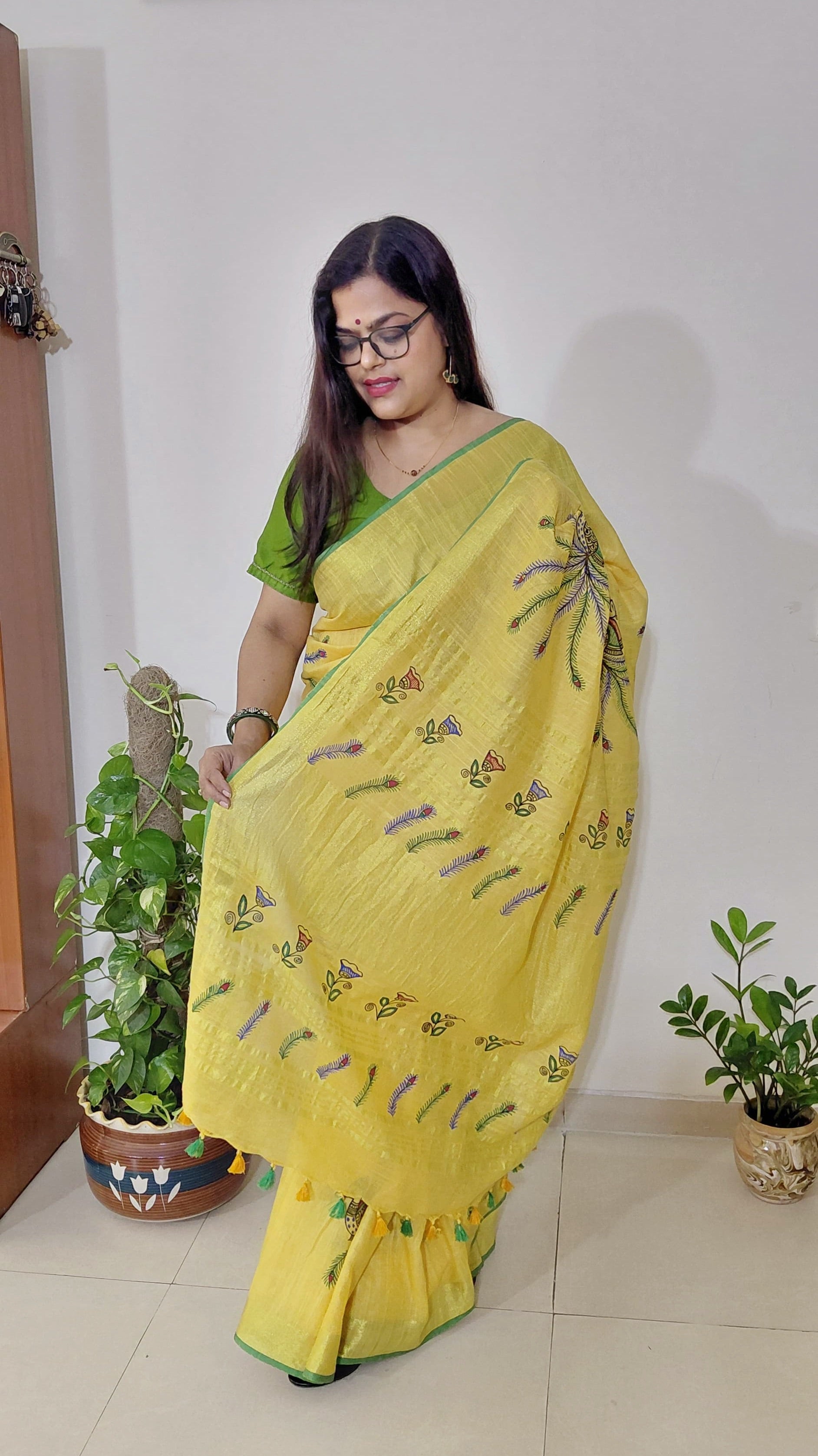 Yellow linen Madhubani saree with peacock motifs and green blouse set