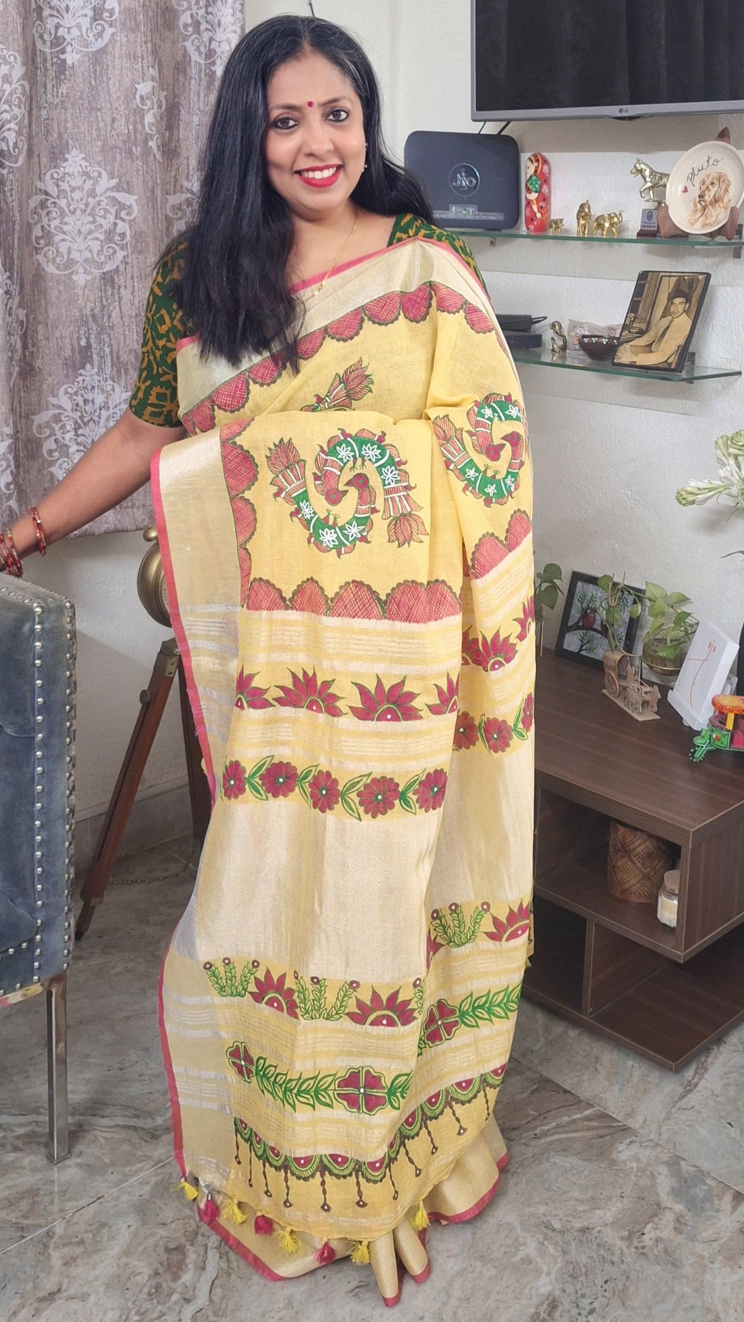 Model wearing yellow linen Madhubani saree with Peacock motifs front view