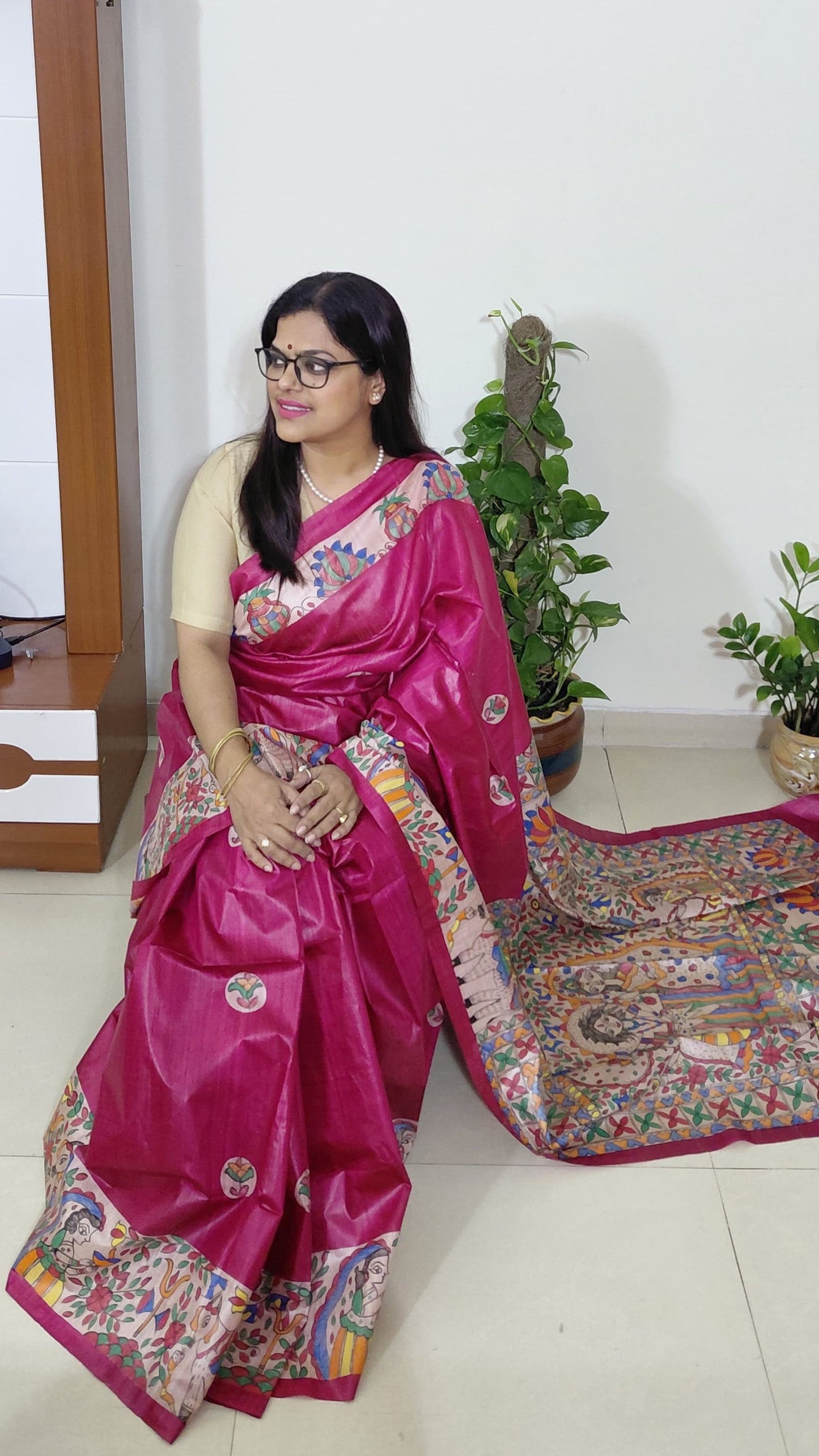 Model wearing devotional Madhubani saree with Shiv Parivar artwork