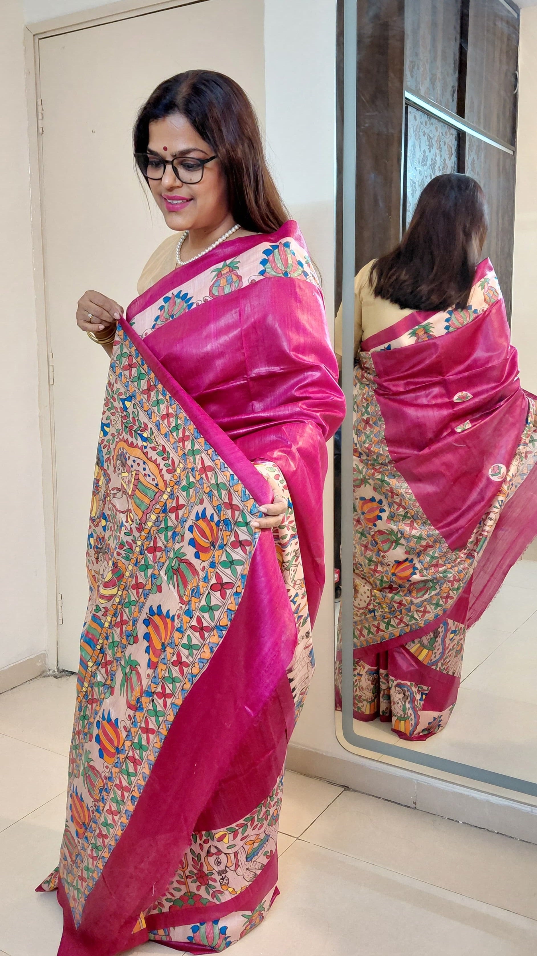 Elegant drape of pure tussar silk saree with devotional theme in madhubani art